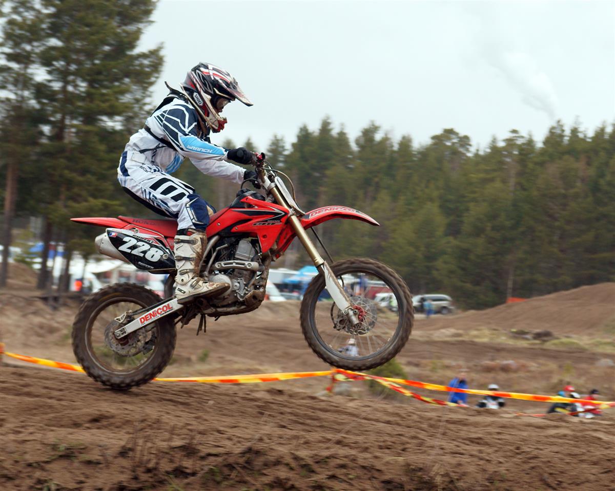 Motocross Racer Railing Deep Rutted Dirt Berm in SuperMotocross Finals